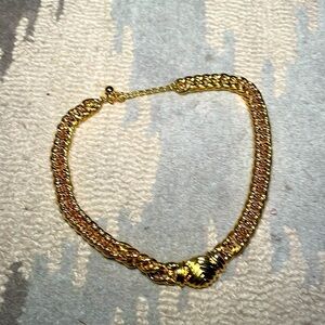 Gold colored costume jewelry, necklace